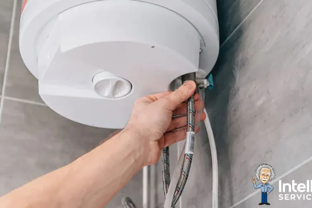 Hand checks pipes of a boiler in a bathroom, with Intelligent Service logo visible.