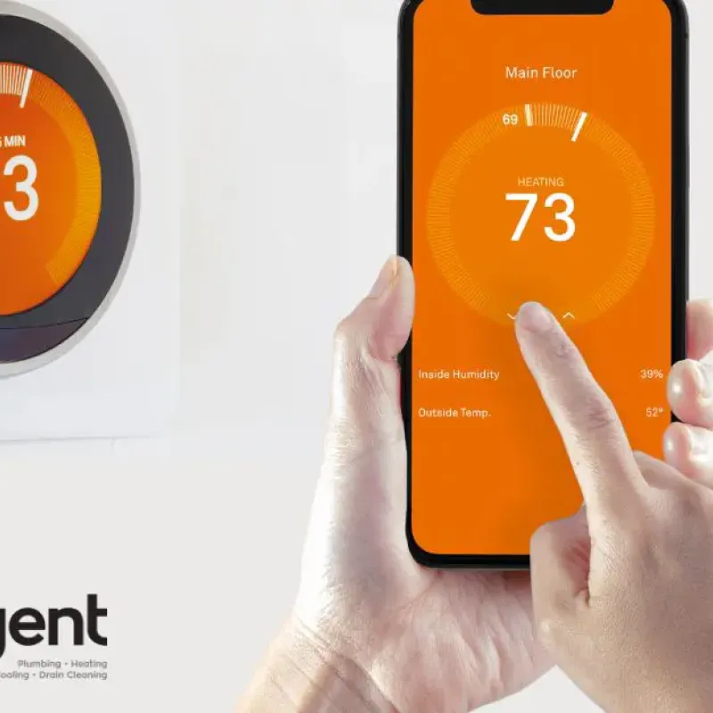 Smart thermostat being controlled via smartphone app, displaying 73 degrees. Intelligent Service HVAC logo visible.