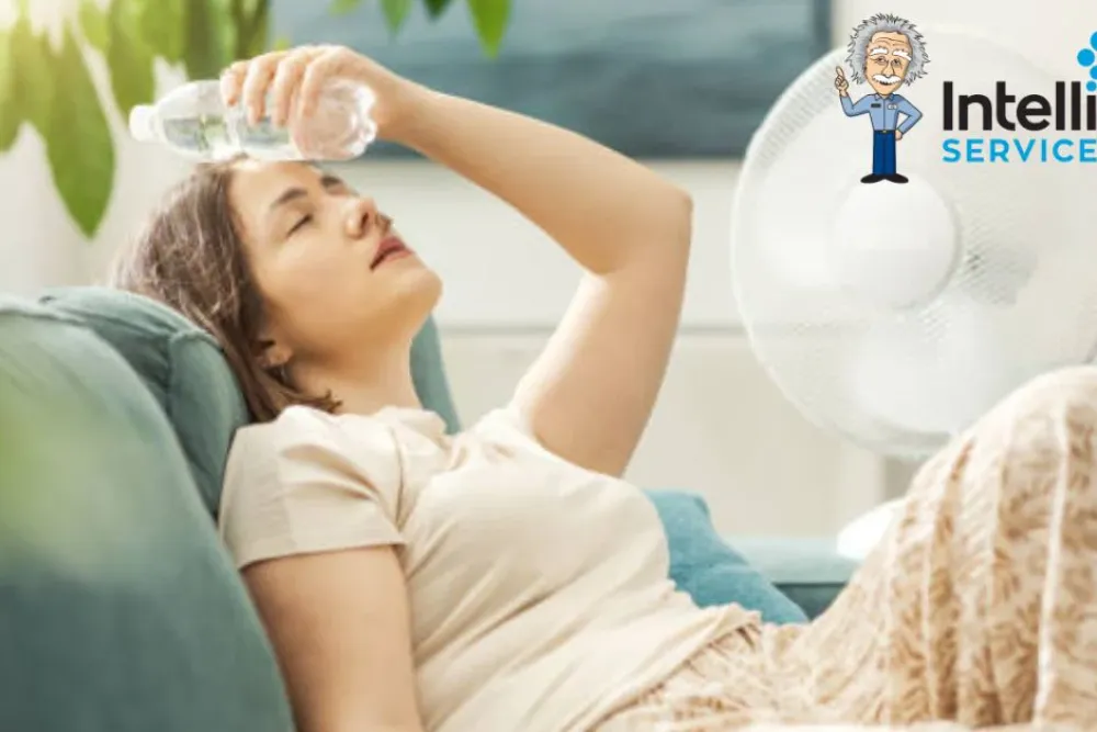 Woman cooling down with water bottle and fan in summer heat. Intelligent Service logo in the background.